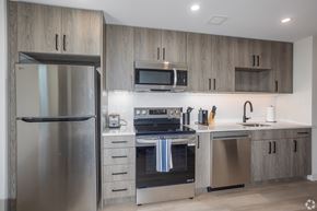 Pittsburgh apartment for rent - A modern kitchen with a stainless steel refrigerator and oven.at The Jones Tower at the Collective, Pittsburgh, PA 15203