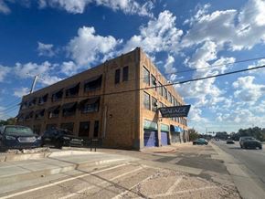 Oklahoma City apartment for rent - A large brick building with the word "GARAGE" on the front.