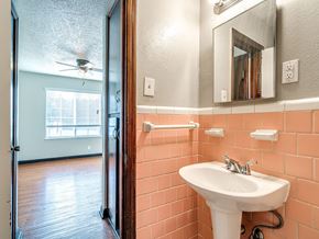 Oklahoma City apartment for rent - a bathroom with a sink and a mirror and a shower