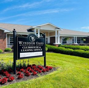 Fort Wayne apartment for rent - A sign for Windsor Oaks Apartment Homes and Clubhouse with leasing office.