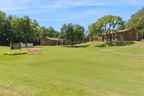 Memphis apartment for rent - A Grassy Field With a Sign at Hilldale Apartments, Tennessee, 38128