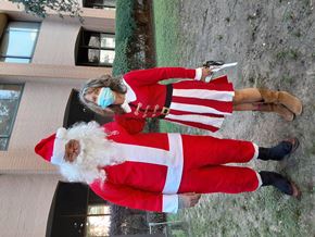 Mobile apartment for rent - a man dressed as father christmas and a woman dressed as santa claus