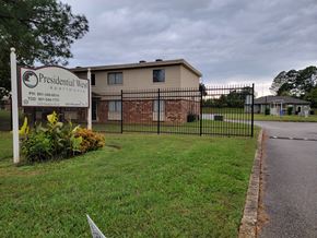 Memphis apartment for rent - a building with a fence and a sign in front of it