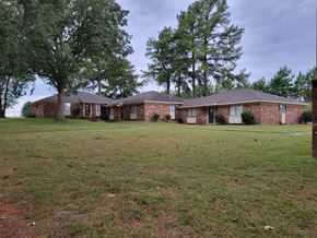 Memphis apartment for rent - a large brick house with trees in front of it