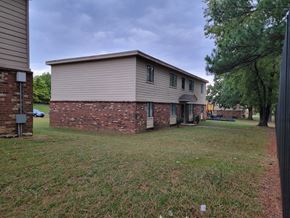 Memphis apartment for rent - a brick and with a yard and trees
