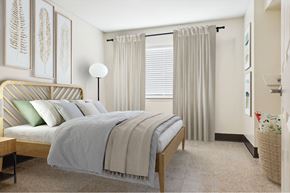 Memphis apartment for rent - A bedroom with a bed, nightstand, and pictures on the wall.