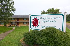 Union City apartment for rent - a sign for the partnership manor apartments in front of a building