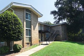 Cleveland apartment for rent - an exterior view of a building with a yard and stairs