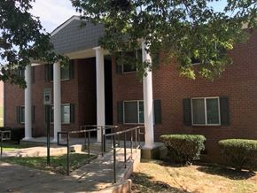 Horse Cave apartment for rent - a brick building with three pillars and a sidewalk