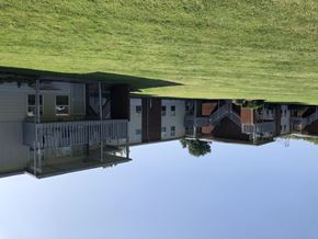 Franklin apartment for rent - A reflection of a building in a body of water.