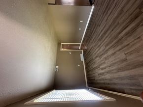 Memphis apartment for rent - A stairwell with a metal railing and a light on the floor.