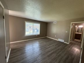 Memphis apartment for rent - A room with a window and wooden flooring.
