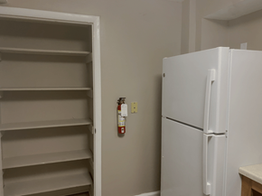 Franklin apartment for rent - A white refrigerator is in a room with a white door and a white wall.
