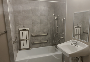 Franklin apartment for rent - A white bathtub sits next to a white sink in a bathroom.