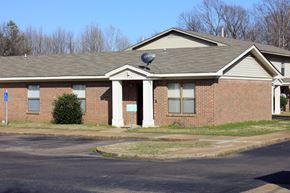 Memphis apartment for rent - a brick house with a satellite dish on the roof