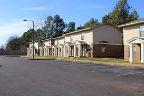 Memphis apartment for rent - a row of apartment buildings on the side of a road