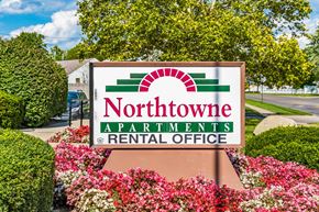Columbus apartment for rent - Rental office sign surrounded by colorful flowers at Northtowne Apartments, Columbus, 43229