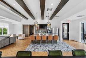 Cincinnati apartment for rent - A modern dining room with a large table and chairs.
