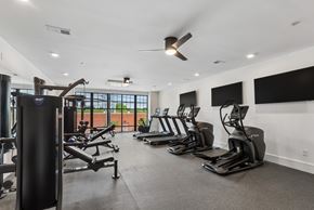 Cincinnati apartment for rent - A gym with treadmills, elliptical machines, and a weight machine.