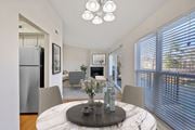 Cincinnati apartment for rent - a dining room with a round table with four chairs and a fireplace in the background at Harpers Point Apartments, Cincinnati, OH