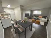 Toledo apartment for rent - A modern kitchen with a dining table and chairs.