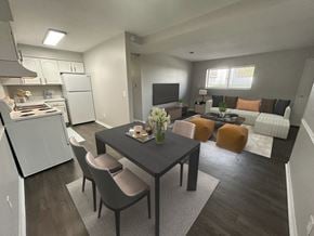 Toledo apartment for rent - A modern kitchen with a dining table and chairs.