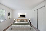 Fairfield apartment for rent - A bedroom with a large bed and a painting on the wall.