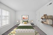 Cincinnati apartment for rent - A bedroom with a large bed and a painting on the wall.