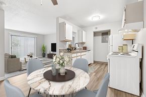 Findlay apartment for rent - A modern kitchen with a dining table set in the middle.
