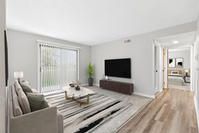 Findlay apartment for rent - A living room with a couch, a coffee table, and a television.