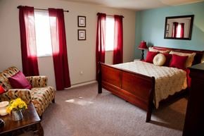 Cincinnati apartment for rent - a bedroom with a bed and a couch