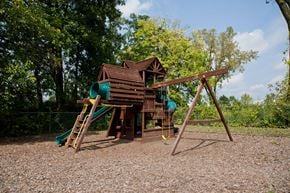 Cincinnati apartment for rent - a playground with a swing set and a jungle gym