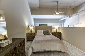 Cincinnati townhouse for rent - a bedroom with a bed in a loft at The Lofts at Shillito Place, Cincinnati, OH, 45202