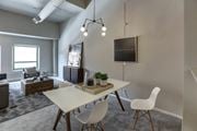 Cincinnati townhouse for rent - a dining room with a white table and chairs at The Lofts at Shillito Place, Cincinnati, OH, 45202