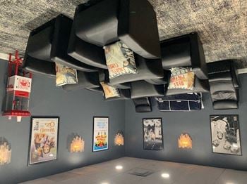 A light hanging from the ceiling of a room