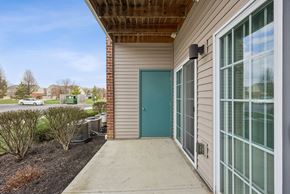 Beavercreek apartment for rent - A building with a blue door and a glass window.