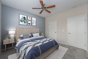 Cincinnati apartment for rent - a bedroom with a bed and a ceiling fan