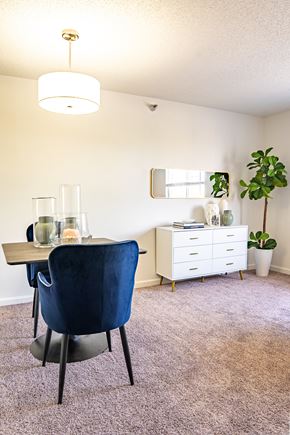 Urbana apartment for rent - a dining room with a table and chairs and a mirror on the wall