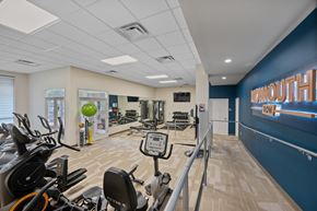 Newport apartment for rent - A gym with exercise equipment and a sign that says "MORNINGOUT".
