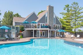 Centerville apartment for rent - A large house with a pool in front.
