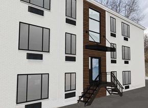 Cincinnati apartment for rent - the side of a white building with black windows