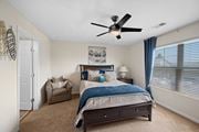 Liberty Township apartment for rent - Bedroom with a bed and a ceiling fan at Four Bridges, Liberty Township