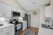 Liberty Township apartment for rent - Renovated kitchen with white cabinets and stainless steel appliances at Four Bridges, OH, 45044-8380