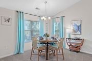 Liberty Township apartment for rent - Dining room with a table and chairs and a chandelier at Four Bridges, Liberty Township, OH, 45044-8380