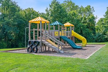 Playground with a slide and other playground equipment