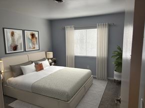 Dayton apartment for rent - A bedroom with a large bed and two framed pictures on the wall.