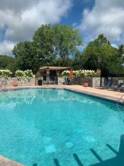 Cincinnati apartment for rent - a large swimming pool with chairs around it at Ivy Hills Living Spaces, Cincinnati