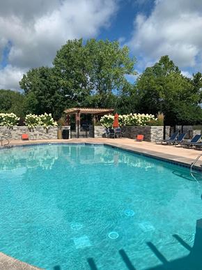 Cincinnati apartment for rent - a large swimming pool with chairs around it at Ivy Hills Living Spaces, Cincinnati