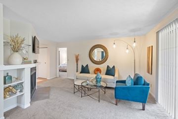 Centerville apartment for rent - A living room with a blue couch and a fireplace.