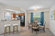 Centerville apartment for rent - Dining area with breakfast bar and kitchen access at Normandy Club Apartments, Ohio, 45459